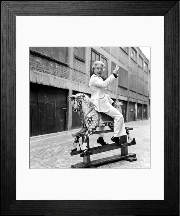 Framed Print : Wrestler Jackie Pallo poses with a rocking horse. February 1975 Framed Print : Wrestler Jackie Pallo poses with a rocking horse. February 1975