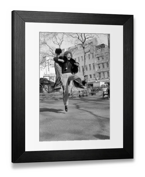 Framed Print : Model Lorne Lesley jumping up in the street February 1975 75-01140-001