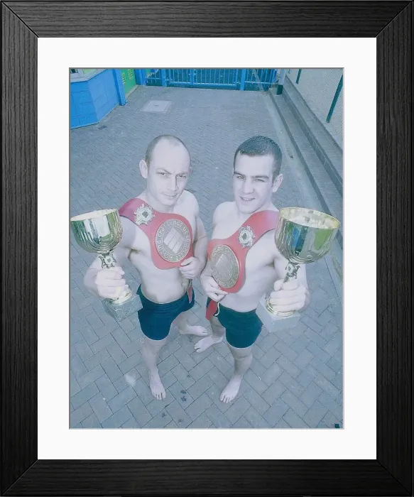  : L-R: Matthew Evans and Justin Gray. Two men hold their Vale Tudo tropies