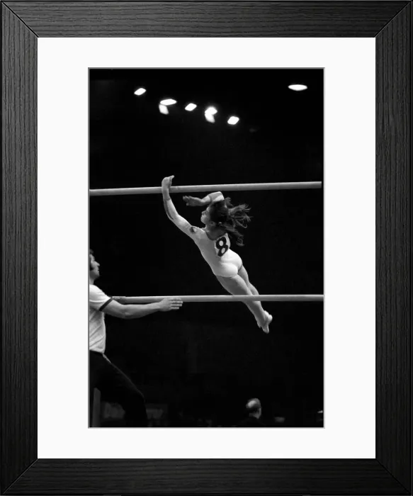 Framed Print : Nadia Comaneci competiting in Champions All'Gymnastics Competition