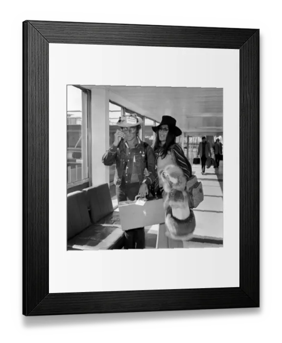 Framed Print : Comedian Marty Feldman with his wife Laurette pictured at Heathrow airport