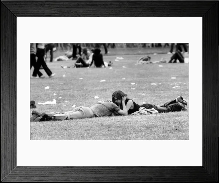 Framed Print : A couple enjoying the open air and the music as well as each others company Framed Print : A couple enjoying the open air and the music as well as each others company
