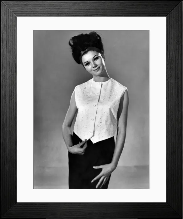 Framed Print : Model Merriel Weston wearing a sleveless blouse top and black skirt
