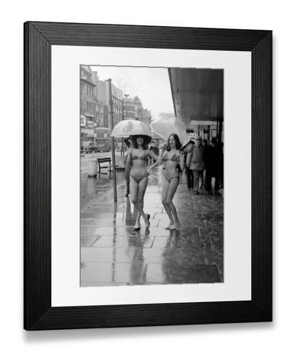Framed Print : Models Wendy and Jackie seen here modeling the latest in swimwear on a wet Oxford Street Framed Print : Models Wendy and Jackie seen here modeling the latest in swimwear on a wet Oxford Street