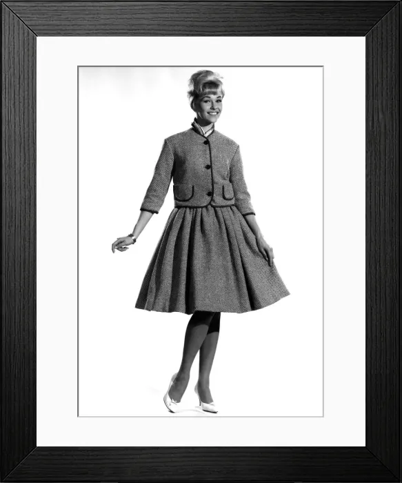 Framed Print : Model Jo Waring wearing a buttoned up jacket and matching skirt. October 1961 P007828 Framed Print : Model Jo Waring wearing a buttoned up jacket and matching skirt. October 1961 P007828