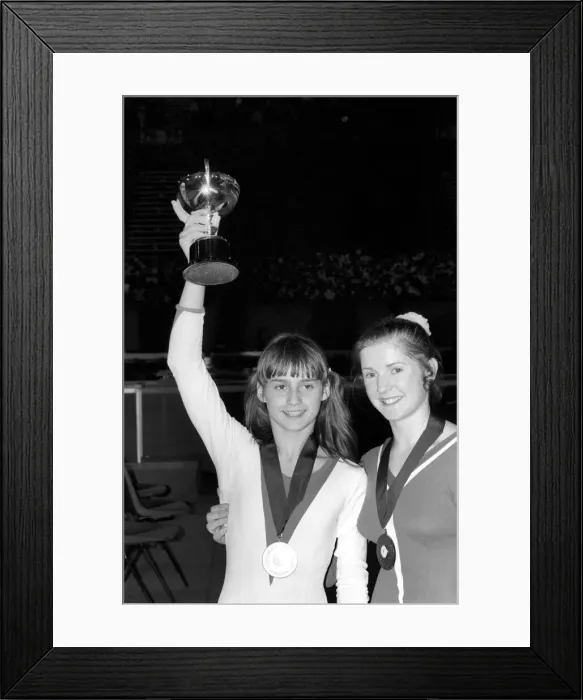 Framed Print : Nadia Comaneci competiting in Champions All'Gymnastics Competition Framed Print : Nadia Comaneci competiting in Champions All'Gymnastics Competition