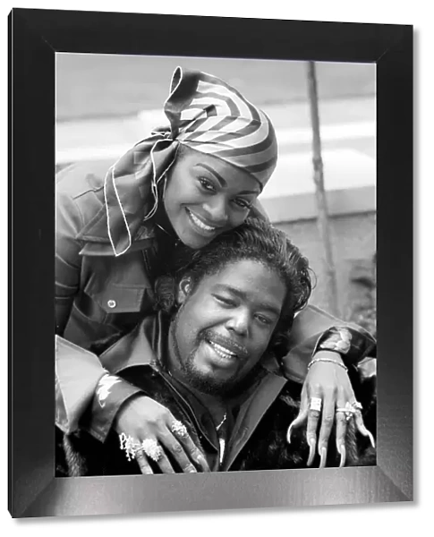 Pop star Barry White with his wife Goldean displaying her affections