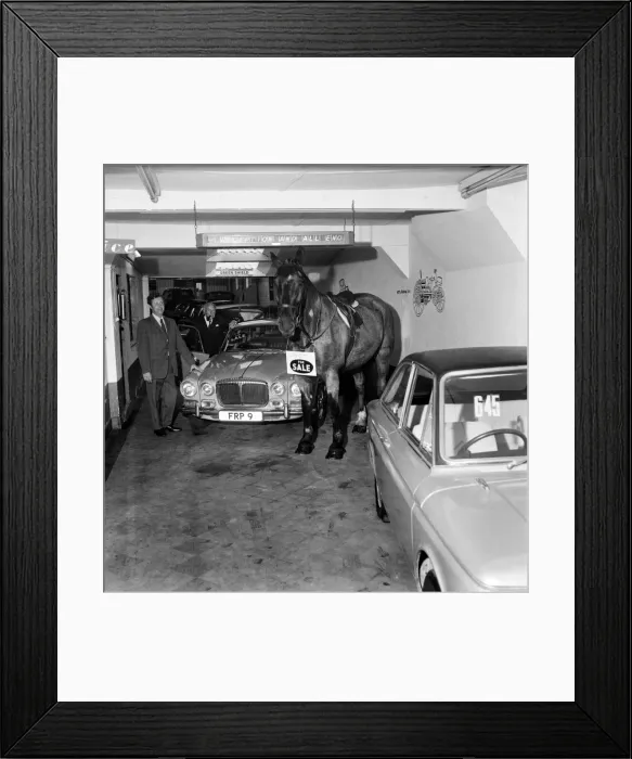 Framed Print : A man who is still selling cars to the public, but has changed his mode of transport Framed Print : A man who is still selling cars to the public, but has changed his mode of transport
