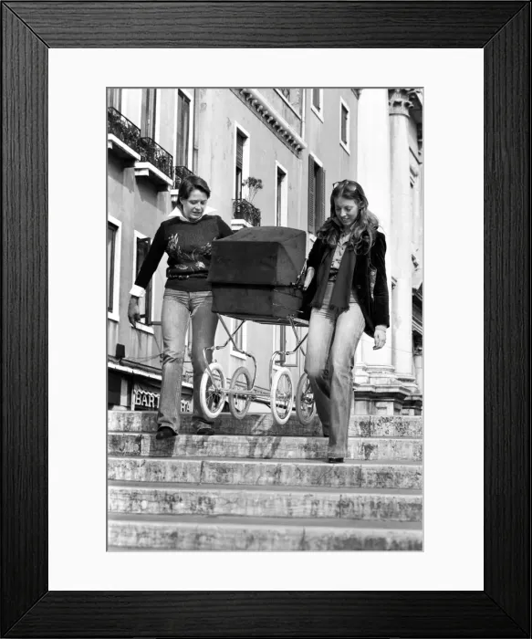 Framed Print : People: Culture: General scenes in Venice. A couple of young women carry a pram over one