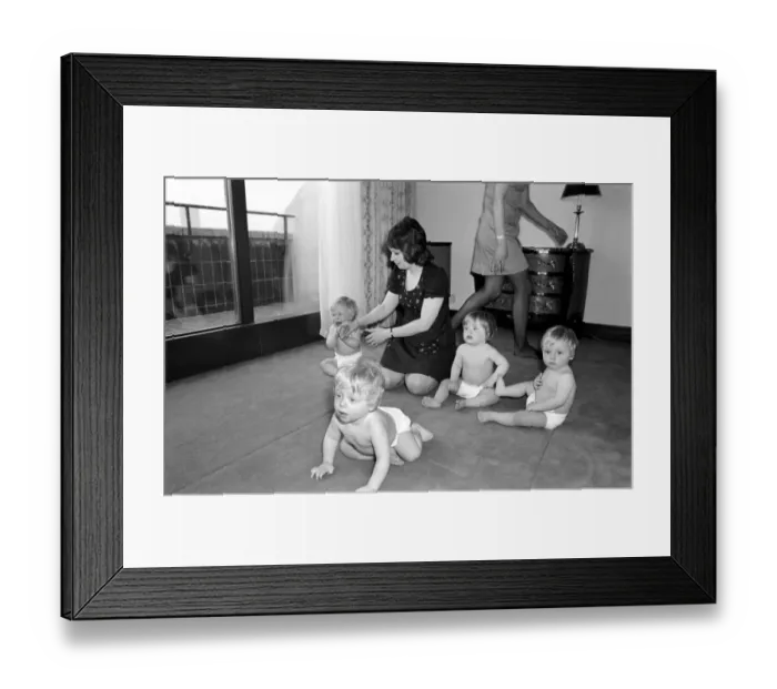 Framed Print : A group of young babies seen here getting cleaned up after getting into a mess with a