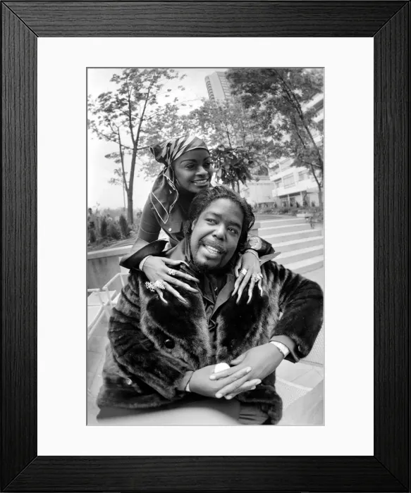 Framed Print : Pop star Barry White with his wife Goldean displaying her affections