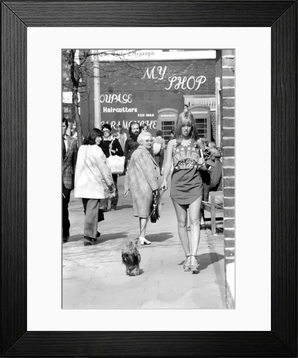 Framed Print : Woman taking her dog for a walk on Kings Road in Chelsea Framed Print : Woman taking her dog for a walk on Kings Road in Chelsea