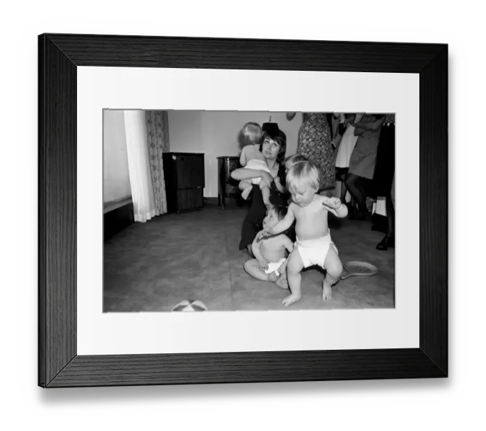 Framed Print : A group of young babies seen here getting cleaned up after getting into a mess with a