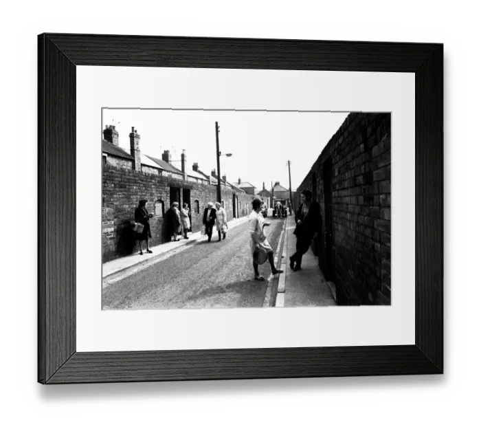 Framed Print : General views of the Northumberland village of Cambois. People wait for Framed Print : General views of the Northumberland village of Cambois. People wait for