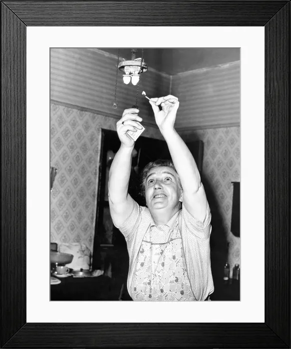 Framed Print : Mrs. May Wheatley will not be lighting the gas mantle in her kitchen much longer as she