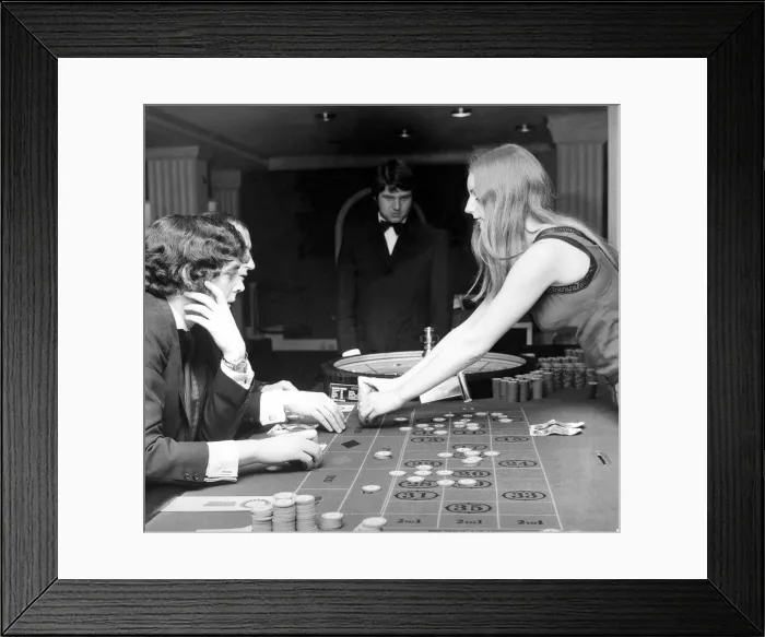 Framed Print : People gambling and playing roulette in a casino in August 1971 Framed Print : People gambling and playing roulette in a casino in August 1971