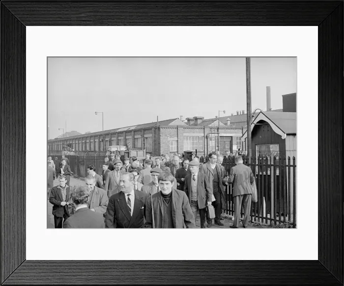 Framed Print : Workers leave Longbridge motor plant in Birmingham after a car delivery on the last day Framed Print : Workers leave Longbridge motor plant in Birmingham after a car delivery on the last day