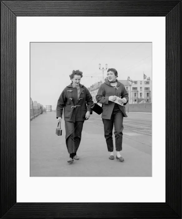 Framed Print : Racing drivers pat Moss and Ann Wisdom aged 21, take a brisk walk along the promenade in Framed Print : Racing drivers pat Moss and Ann Wisdom aged 21, take a brisk walk along the promenade in