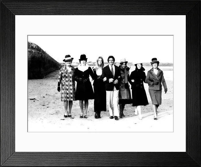 Framed Print : Singer Frankie Vaughan strolling along the beach with some of the models from a fashion Framed Print : Singer Frankie Vaughan strolling along the beach with some of the models from a fashion