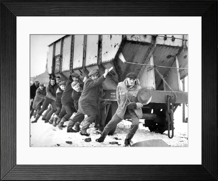 Framed Print : These men are trying to make a quick getaway with this rail truck full of coal during Framed Print : These men are trying to make a quick getaway with this rail truck full of coal during