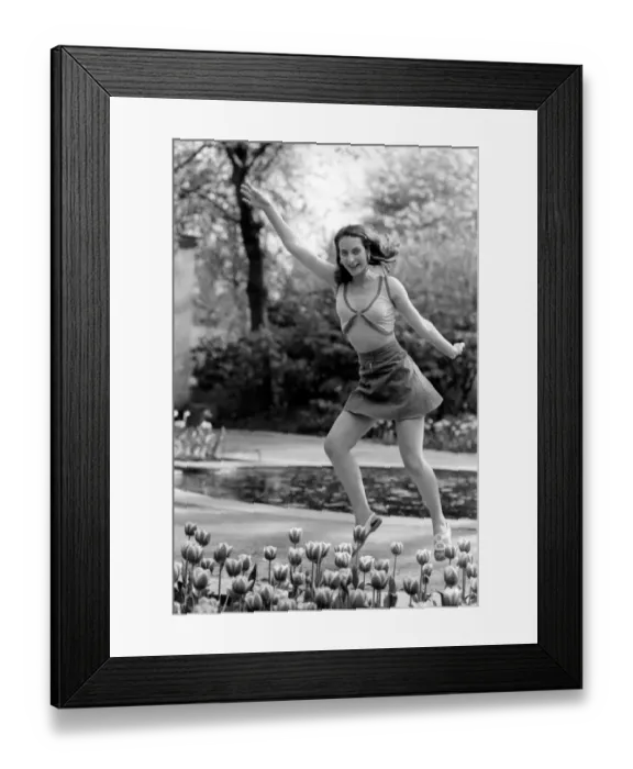 Framed Print : 21 years old Marie France dancing amongst the tulips in her local park Framed Print : 21 years old Marie France dancing amongst the tulips in her local park