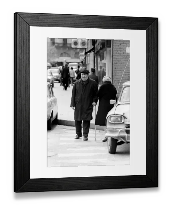 Framed Print : A man in a French town walking down the street April 1975 75-2078-013