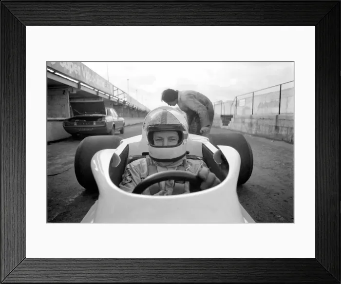 Framed Print : Racing driver John Surtees trying his new car. January 1976 76-00088-001 Framed Print : Racing driver John Surtees trying his new car. January 1976 76-00088-001