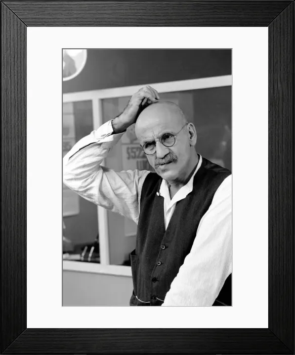 Framed Print : Warren Mitchell scratches his head trying to decide which team he wants to win the cup