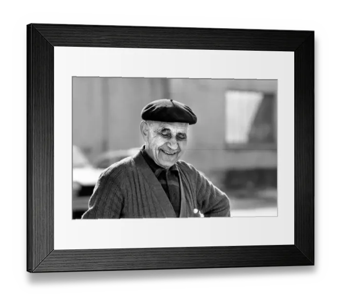 Framed Print : An old man of Paris wearing beret, scarf and coat on a cold day in France April
