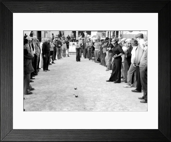 Framed Print : Frenchmen play Boules in the streets of Poussan, France. April 1975 75-2097-003