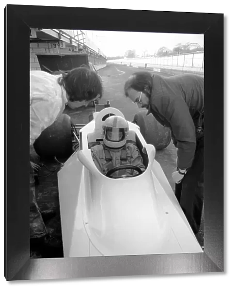 Racing driver John Surtees trying his new car. January 1976 76-00088-004