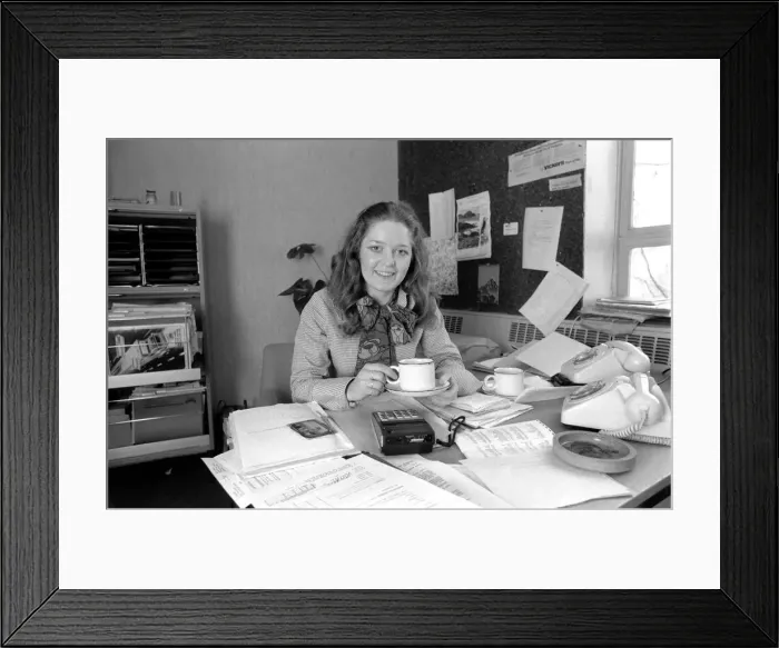 Framed Print : A desk covered with paper, empty coffee mugs and a calculator symbols of the busy Framed Print : A desk covered with paper, empty coffee mugs and a calculator symbols of the busy
