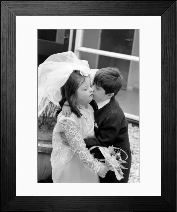 Framed Print : Children wedding has Police guard. Police guard for child bride wearing Pilkington