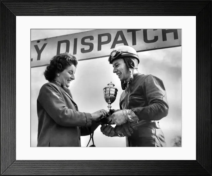 Framed Print : Motor cycle racing. Oulton Park Spring Meeting. Mrs. Geoff Duke presents a triumphant Framed Print : Motor cycle racing. Oulton Park Spring Meeting. Mrs. Geoff Duke presents a triumphant