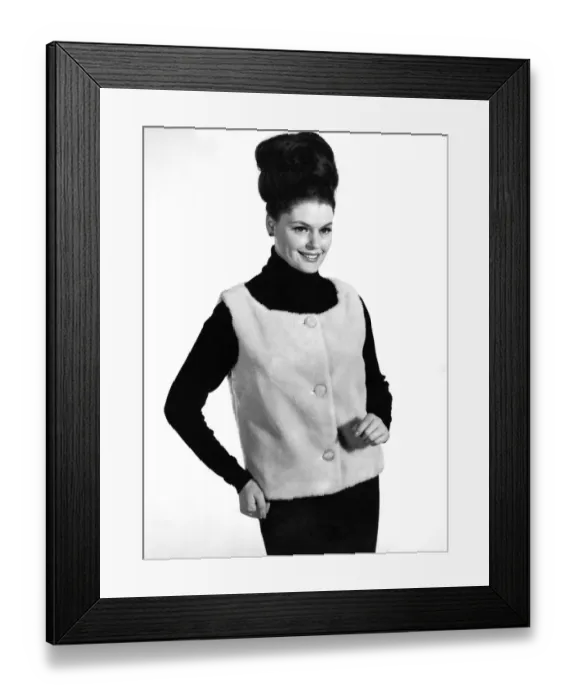 Framed Print : Reveille Fashions 1964: Gloria James modeling a fur waistcoat. January 1964 P007613 Framed Print : Reveille Fashions 1964: Gloria James modeling a fur waistcoat. January 1964 P007613