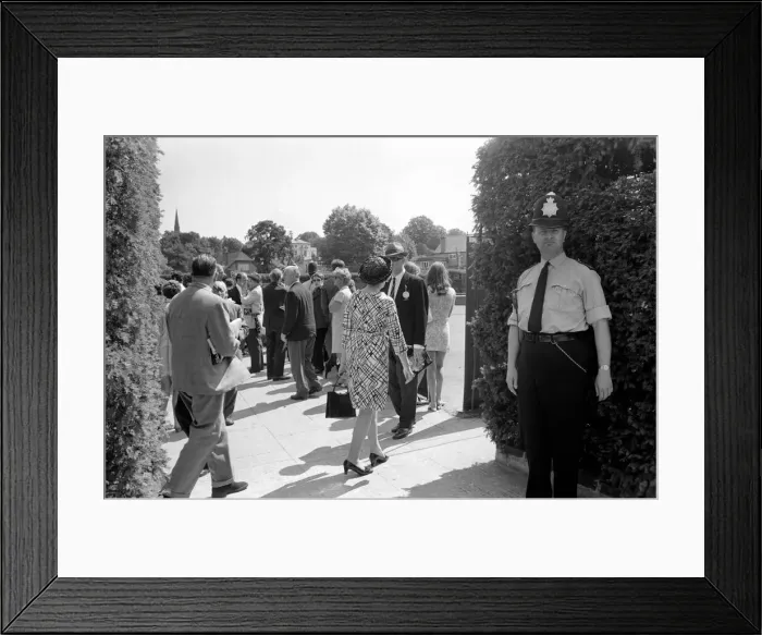 Framed Print : Wimbledon Tennis Championships 1970 1st Day. A policeman stands in the shadow