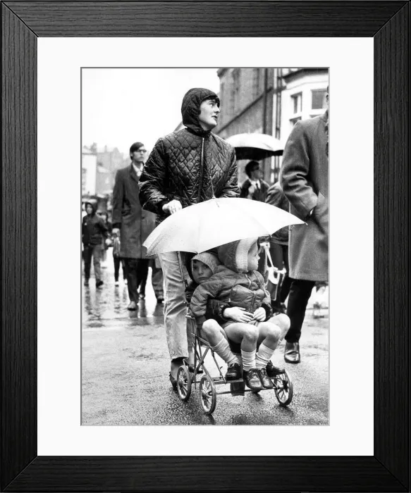 Framed Print : Durham Miners Gala - The heavens may have opened, but these two young gala spectators are