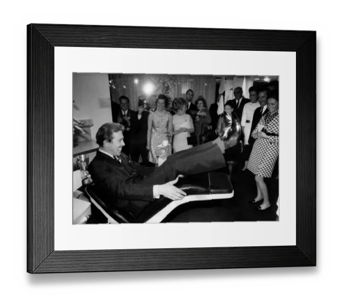 Framed Print : Lord Snowdon trying out the motorised reclining dentist chair at the exibition