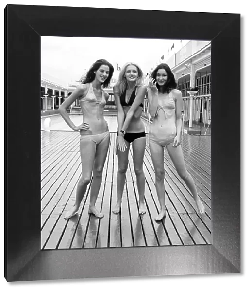 Three women modelling the latest in bikini fashions July 1970 70-6839-001