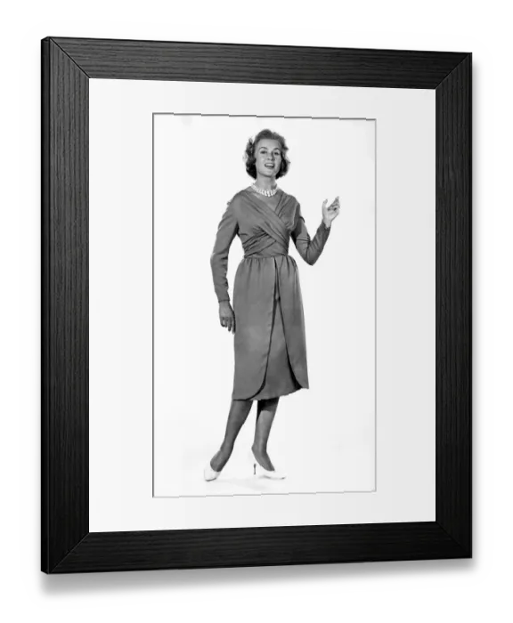 Framed Print : Reveille Fashions: Rosemary Steward modelling the latest 1959 design cocktail dress