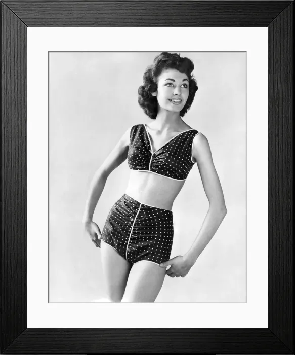 Framed Print : Clothing Fashion 1958. Model wearing a two piece polka dot swimming costume Framed Print : Clothing Fashion 1958. Model wearing a two piece polka dot swimming costume