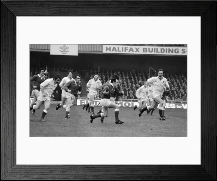 Framed Print : Five Nations 1977. England v Wales. Welsh captain Phil Bennett running with Framed Print : Five Nations 1977. England v Wales. Welsh captain Phil Bennett running with