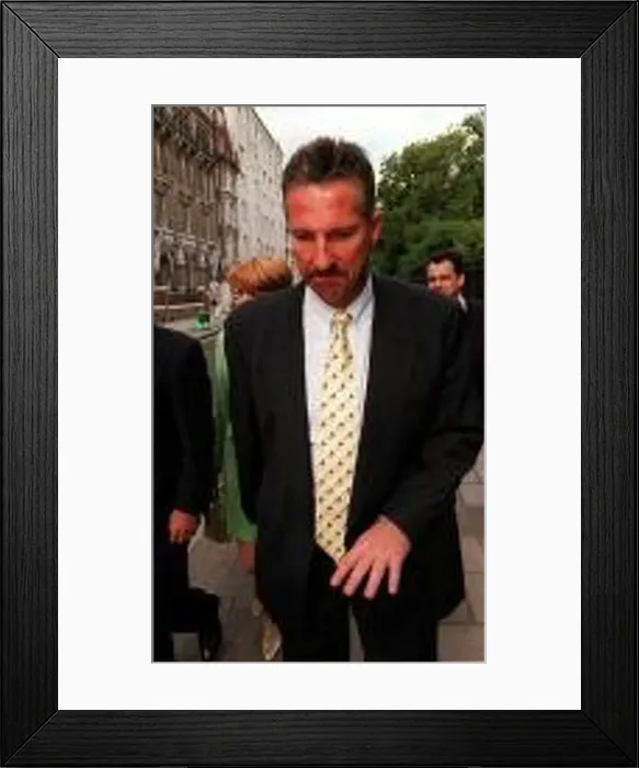 : Ian Botham leaving the High Court after losing his libel case against Imran Khan : Ian Botham leaving the High Court after losing his libel case against Imran Khan