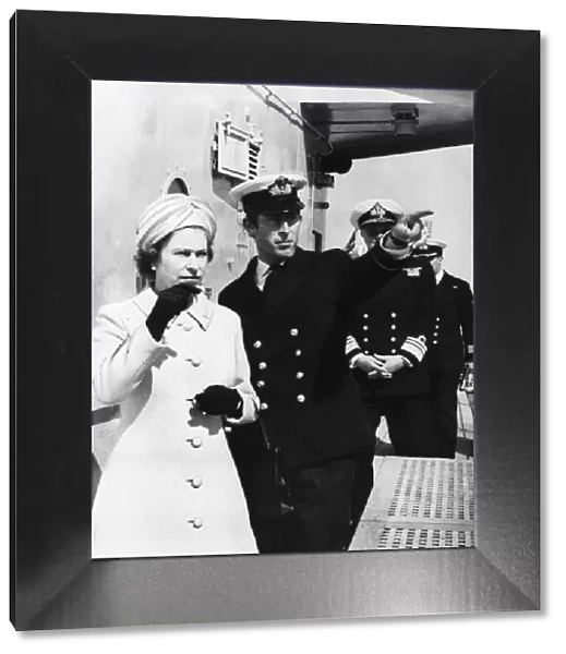 Queen Elizabeth and Prince Charles touring the warship HMS Norfolk the 6