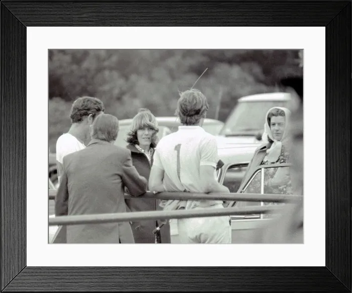 Framed Print : Prince Charles leans back on to railings as he chats with Camilla Parker Bowles during a Framed Print : Prince Charles leans back on to railings as he chats with Camilla Parker Bowles during a