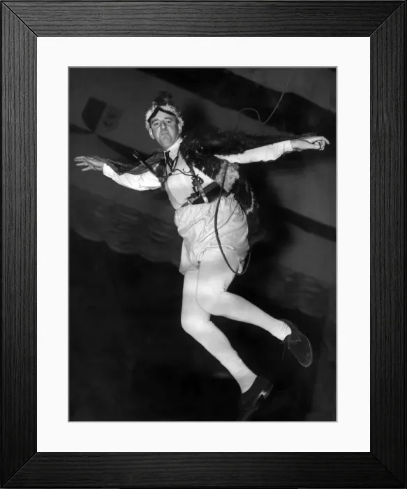 Framed Print : BBC Commentator Brian Johnston takes a practice flight through the air at the Empress Framed Print : BBC Commentator Brian Johnston takes a practice flight through the air at the Empress