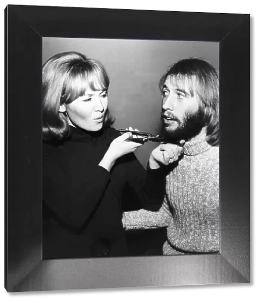 Lulu singer giving husband Maurice Gibb of the Bee Gees a shave
