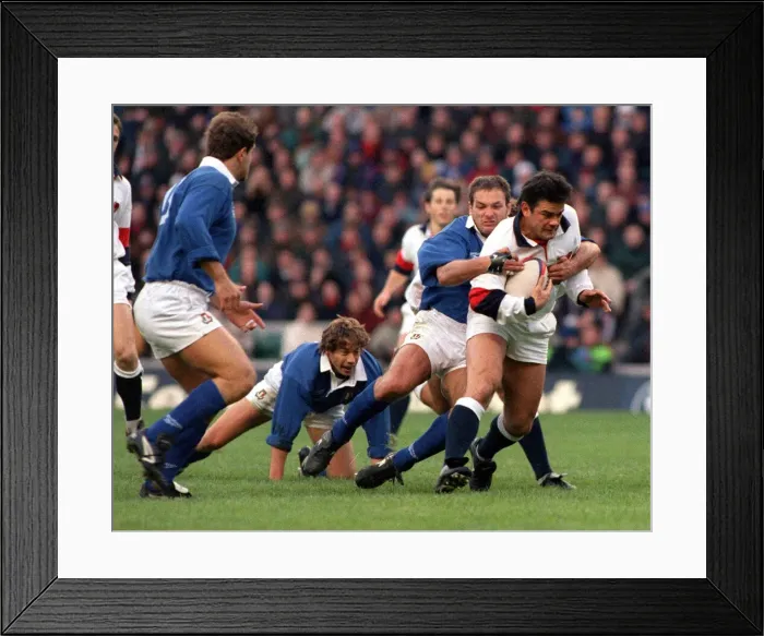 Framed Print : Will Carling is tackled as he tries to break the Italian defence during the England v