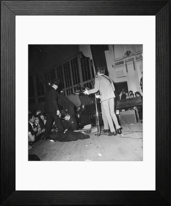 Framed Print : George Harrison and Paul McCartney performing onstage during the Beatles