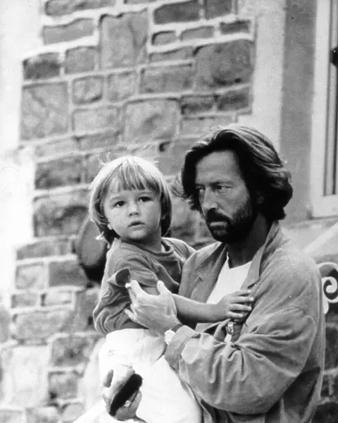 Eric Clapton singer and songwriter holds his son Conor
